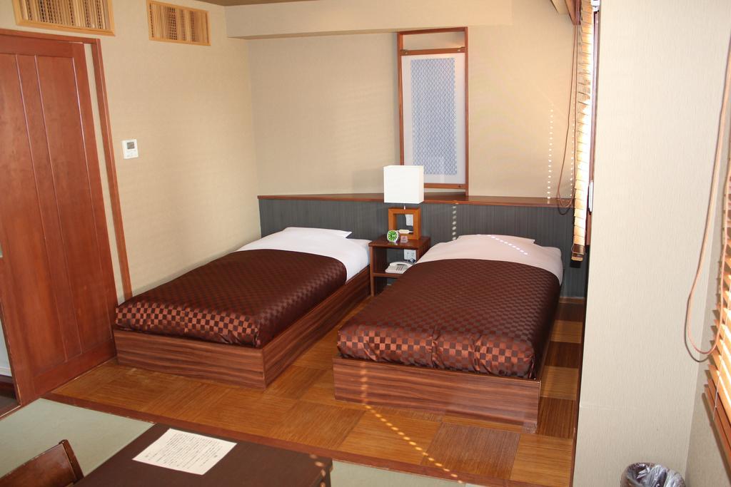 Hotel Saika Fujisawa Quarto foto