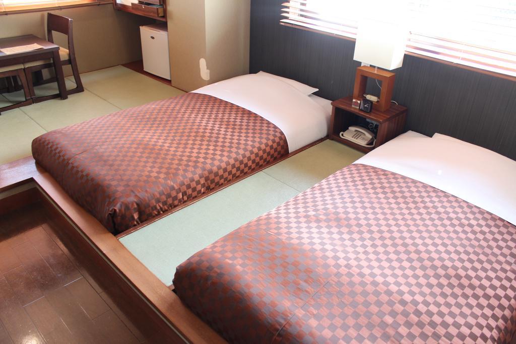 Hotel Saika Fujisawa Quarto foto